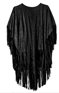 Close-up of black suede poncho featuring hollow-out patterns and delicate fringe tassels