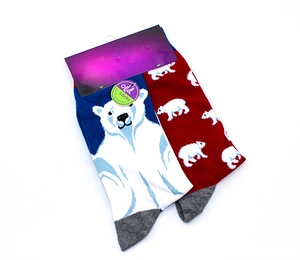 Close-up of cotton socks with polar bear patterns and branded packaging cardboard