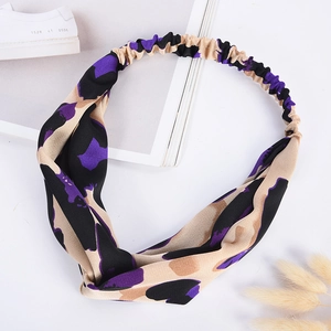 Elastic leopard print headband in beige and purple with a stylish knotted front design