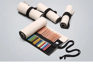 Detailed view of canvas pencil wrap showing storage for colored pencils and erasers