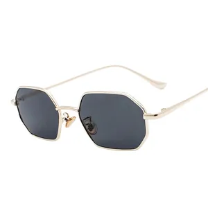 Octagonal gold metal frame sunglasses with dark lenses for men and women