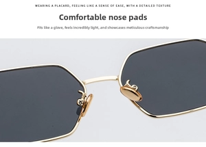 Detail shot of golden metal sunglasses frame focusing on comfortable nose pads and bridge
