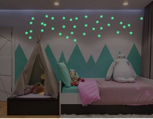 Glow in the dark star stickers in a cozy nursery room setting at night