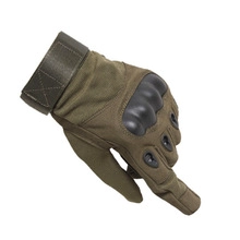 Detail of olive green tactical gloves with hard shell knuckle protection and velcro strap