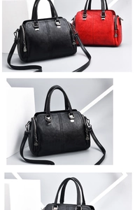 Detail view of stylish red and black textured leather handbags with silver hardware