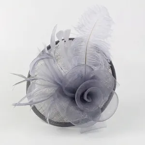 Elegant grey fascinator hat with delicate mesh flower and soft feathers for wedding