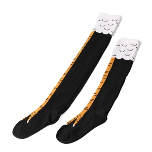 Macro detail of over-knee chicken leg socks with cartoon claws and feather print