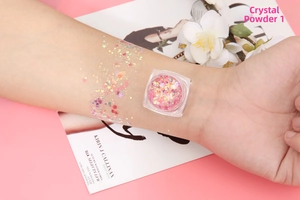 Macro shot of Crystal Powder 01 glitter gel with pink-gold sequins on arm for eye makeup