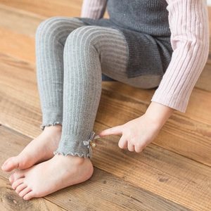 Detail of baby knee socks with breathable mesh cotton fabric and wave edge bow design