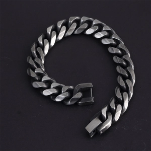 Vintage silver steel Cuban link bracelet with square clasp on black background