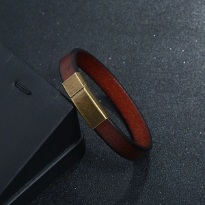 Men's minimalist brown leather bracelet with an antique brass magnetic clasp