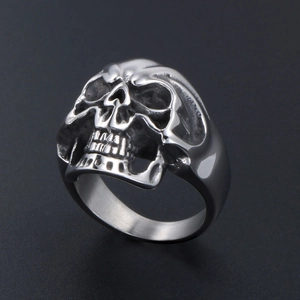 Exaggerated silver skull ring for men made of durable stainless steel on grey background