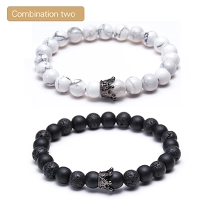 Macro detail of natural lava rock, white turquoise beads, and micro-pave crown charm