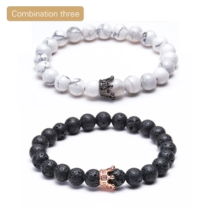 Detail of lava rock and white turquoise beaded bracelets with micro-pave crown charms
