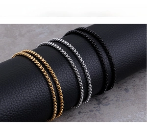 Detailed view of polished 3mm stainless steel box chains in gold, silver, and black finishes