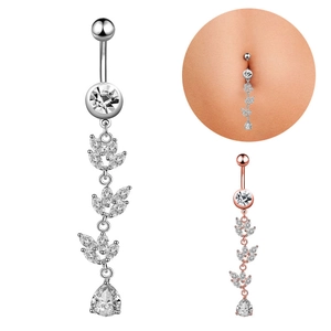 Detail view of leaf dangle belly button ring with zircon stones in silver and rose gold