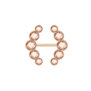 Macro shot of rose gold nipple ring featuring champagne pink zircon gemstones