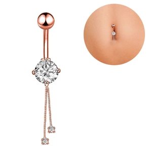 Rose gold belly ring with zircon stones and tassel pendant shown on a model's abdomen