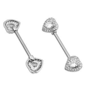 Macro shot of silver heart-shaped nipple rings with sparkling cubic zirconia inlay
