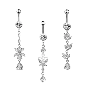 Detailed view of zircon belly rings featuring flower, butterfly, and leaf designs