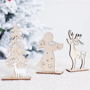 Nordic wooden Christmas ornaments with reindeer and angel figures on white plush background