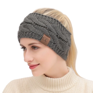 Dark grey chunky knit headband with twisted cable pattern and a classic C.C leather tag