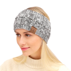 Detailed knit texture of grey speckled winter headband featuring a leather logo patch