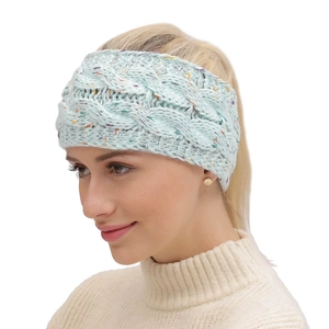 Detail of mint green cable-knit headband for women with colorful flecked yarn texture