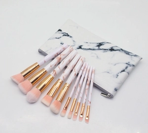Detailed set of 10 marble-textured makeup brushes with matching portable zipper travel pouch