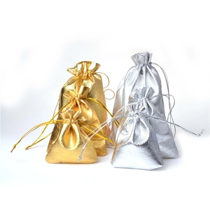 Detail of gold and silver metallic drawstring gift bags in various sizes and textures