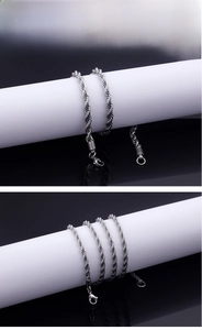 Macro detail of silver stainless steel twist rope chain with a secure lobster clasp