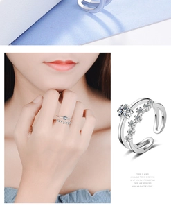 Detail of double-layer silver star ring with clear zircon stones and adjustable open band
