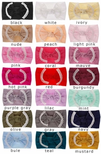 Detailed view of 21 soft nylon baby headbands with delicate lace and cute bows