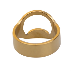 Detailed shot of golden stainless steel bottle opener ring with polished metallic finish