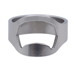 Macro view of silver stainless steel ring bottle opener with polished metallic texture
