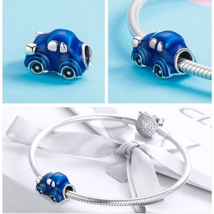 Detail of blue car travel charm in 925 silver with enamel finish for DIY bracelets