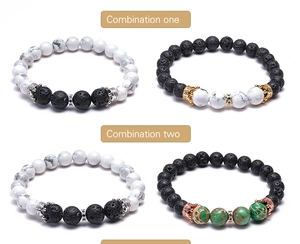 Detailed close-up of volcanic lava stone and white turquoise crown charm bracelets