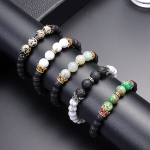 Five beaded bracelets with lava stone, turquoise and micro-pave crown charms on display