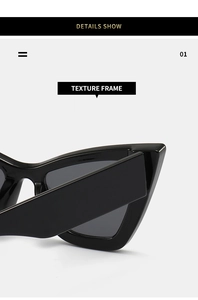 Macro detail of glossy black thick frame and hinge of the stylish cat eye sunglasses