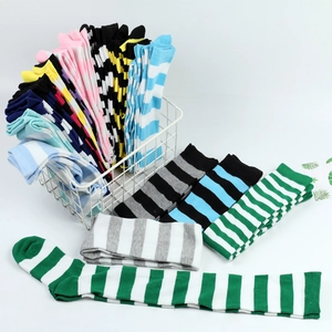 Detailed display of colorful striped thigh-high socks in various shades and patterns