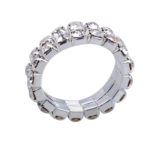 Macro detail of three-row crystal stretch ring showing silver base and rhinestone settings