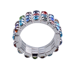 Detailed close-up of a wide elastic ring featuring three rows of colorful crystal rhinestones