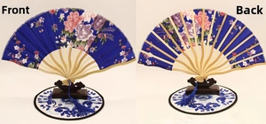 Front and back view of a blue silk folding fan with bamboo ribs and peony flower patterns