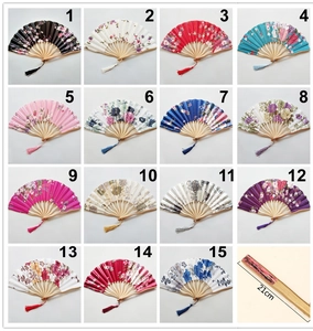 Detailed view of 15 Japanese style floral silk folding fans with tassels and 21cm size