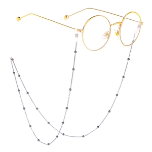 Minimalist gold round frame glasses with a delicate silver beaded metal eyewear chain