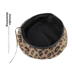 Detail of leopard print beret interior featuring adjustable drawstring and black lining