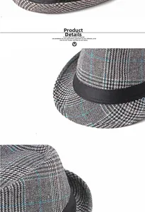 Close-up of grey plaid wool fedora hat fabric with blue stripes and black ribbon band
