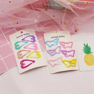 Detail of 12-piece colorful heart and butterfly hair clips on sweet baby card packaging
