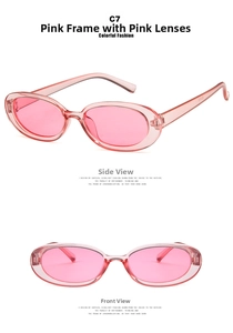 Close-up of retro oval sunglasses with transparent pink frames and pink tinted lenses