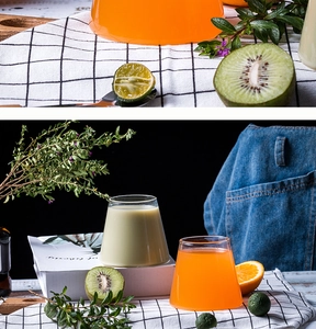 Artistic Mount Fuji glass cups filled with colorful juice on a rustic table setting